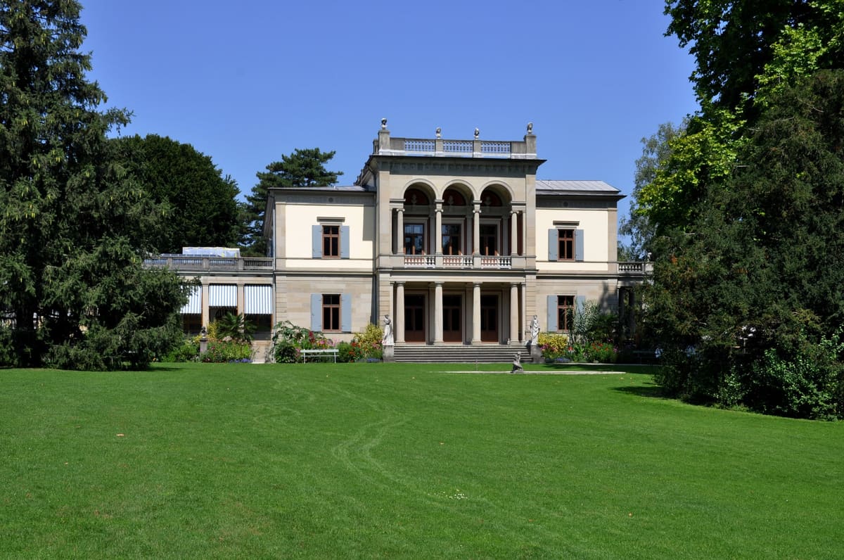 The neo-classical Villa Wesendonck of Museum Rietberg in Zurich behind a wide lawn