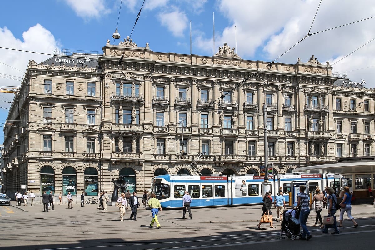 Paradeplatz on Bahnhofstrasse in Zurich with a blue tram and historic bank building (photo 2011)