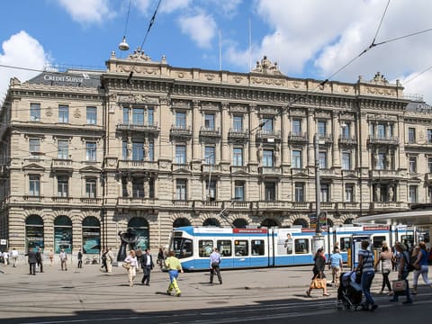 Paradeplatz on Bahnhofstrasse in Zurich with a blue tram and historic bank building (photo 2011)