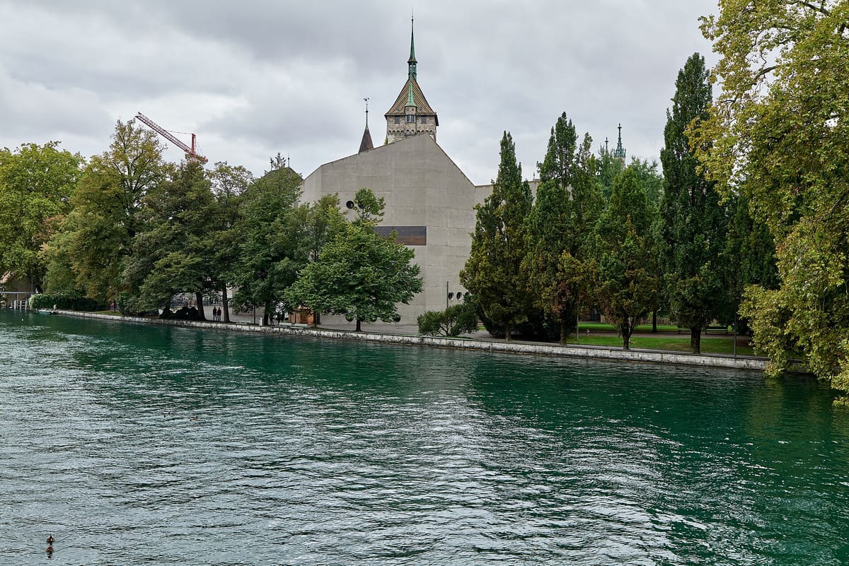 Swiss National Museum building in Zurich seen across the river from Neumühlequai