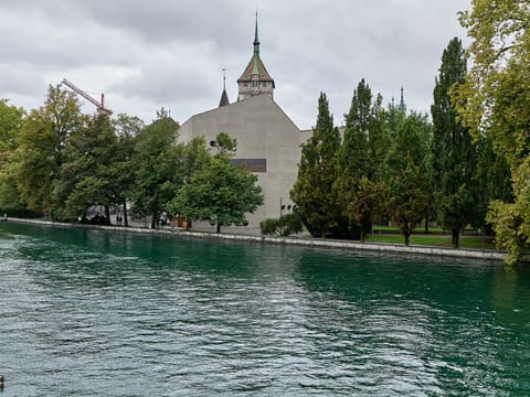 Swiss National Museum building in Zurich seen across the river from Neumühlequai
