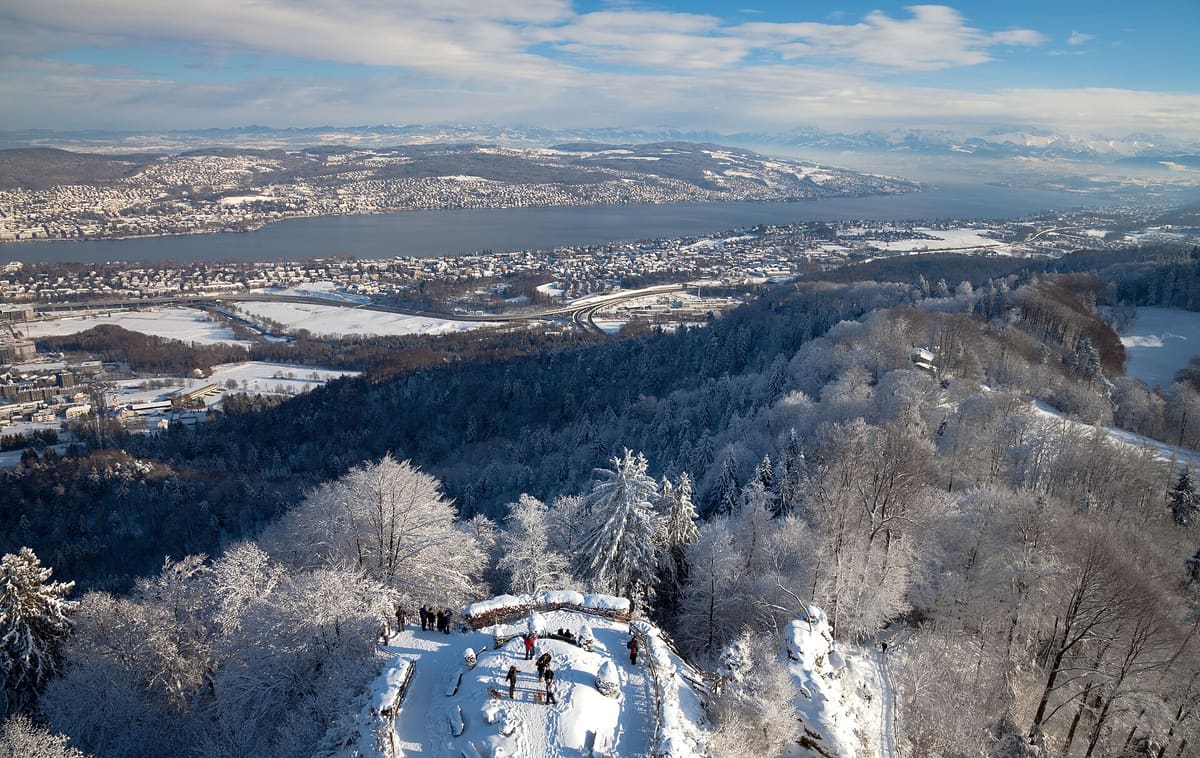 Snowy Uetliberg summit with the view over Zurich and Lake Zurich in winter