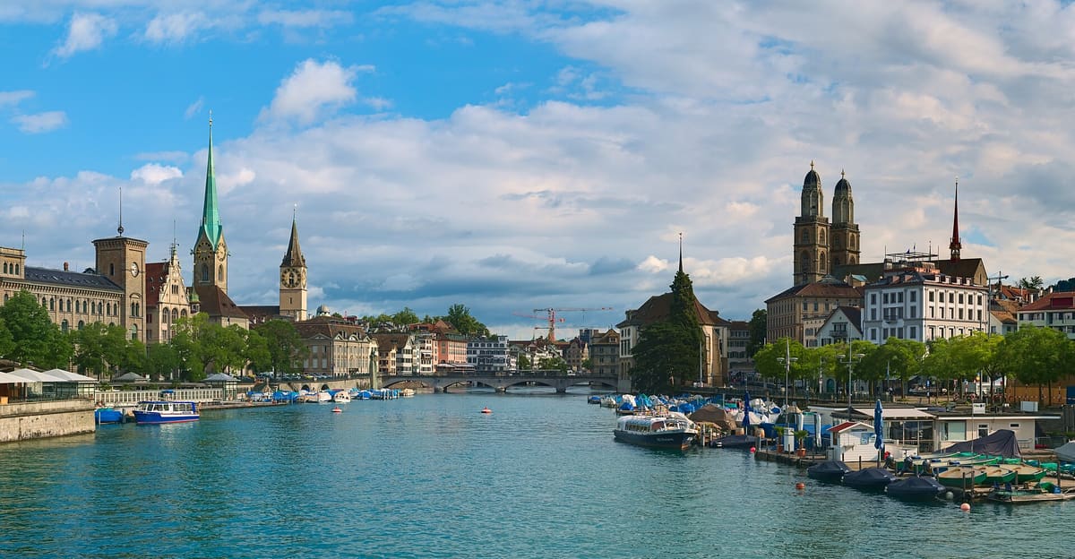 View down the river Limmat from the Quaibrücke with the Fraumünster and Grossmünster towers on either bank